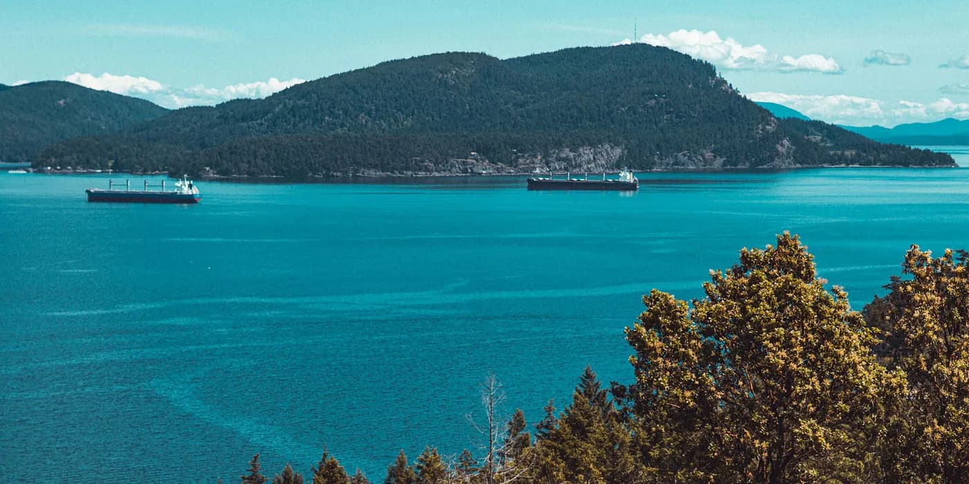 Tankers at anchor in a clear blue bay